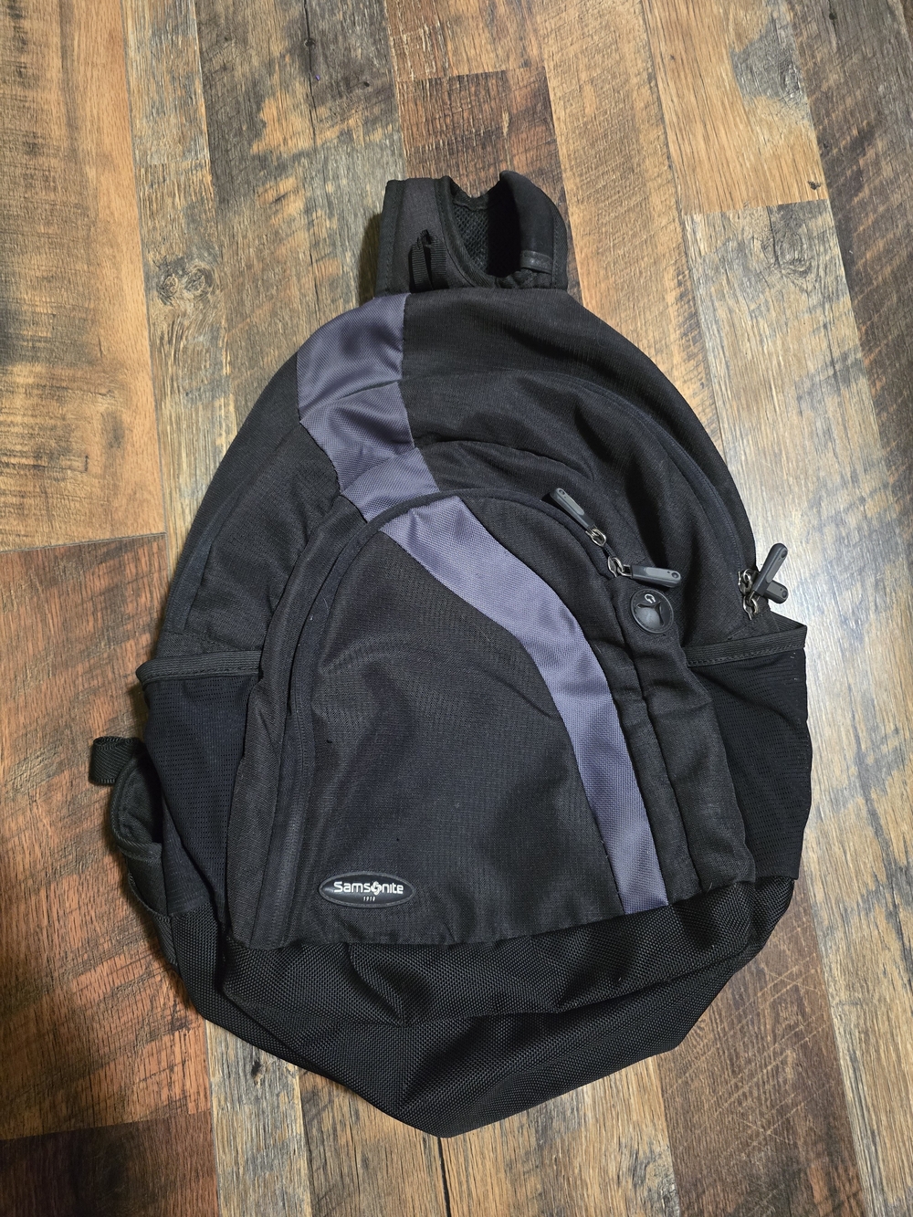 Samsonite Black and Gray Men's Sling Backpack with Front Zip Pocket